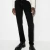 Fendi x Noel Fielding logo-patch slim-fit jeans