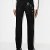 Fendi x Noel Fielding logo-patch slim-fit jeans