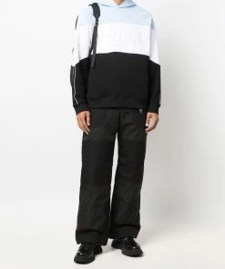 Fendi monogram-print panelled trousers